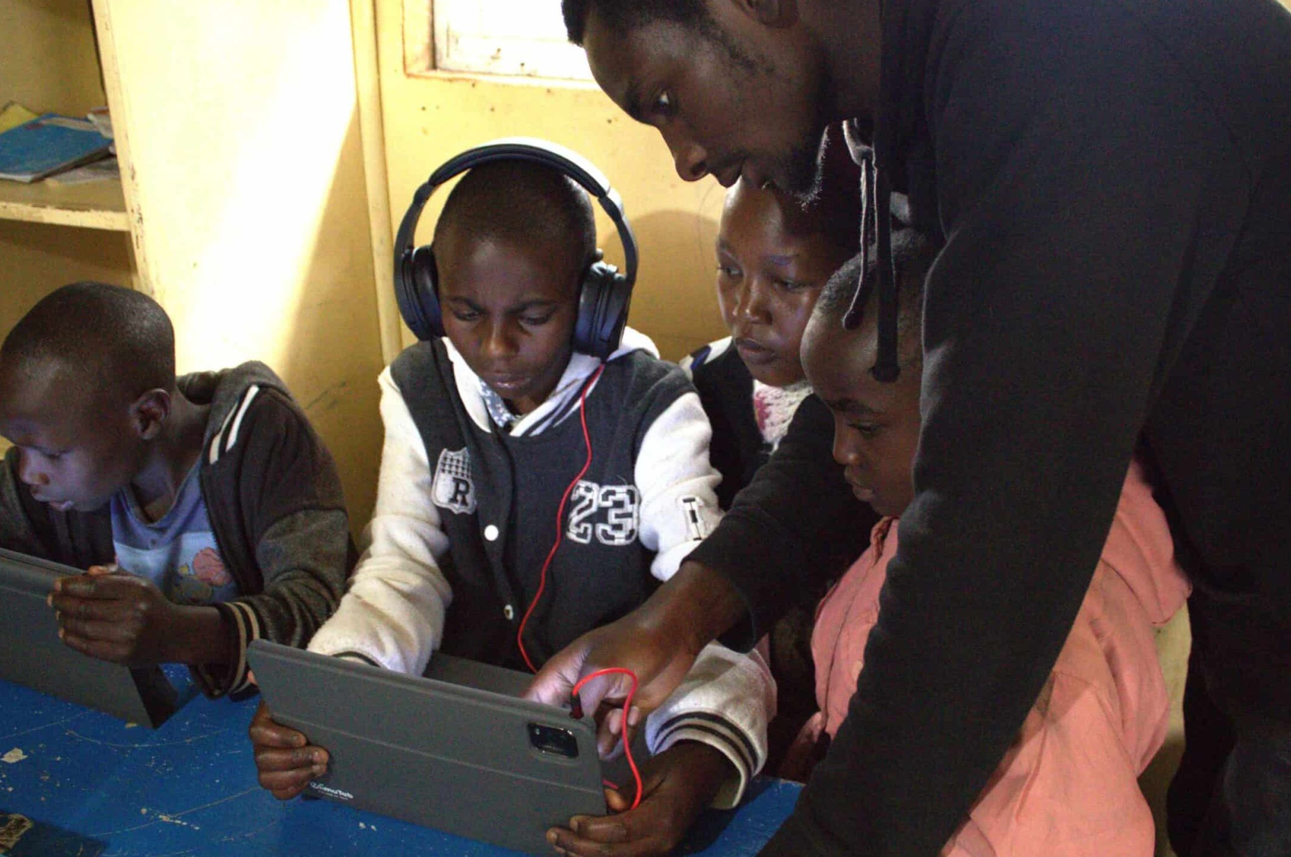 Children taught on use of digital learning device 2