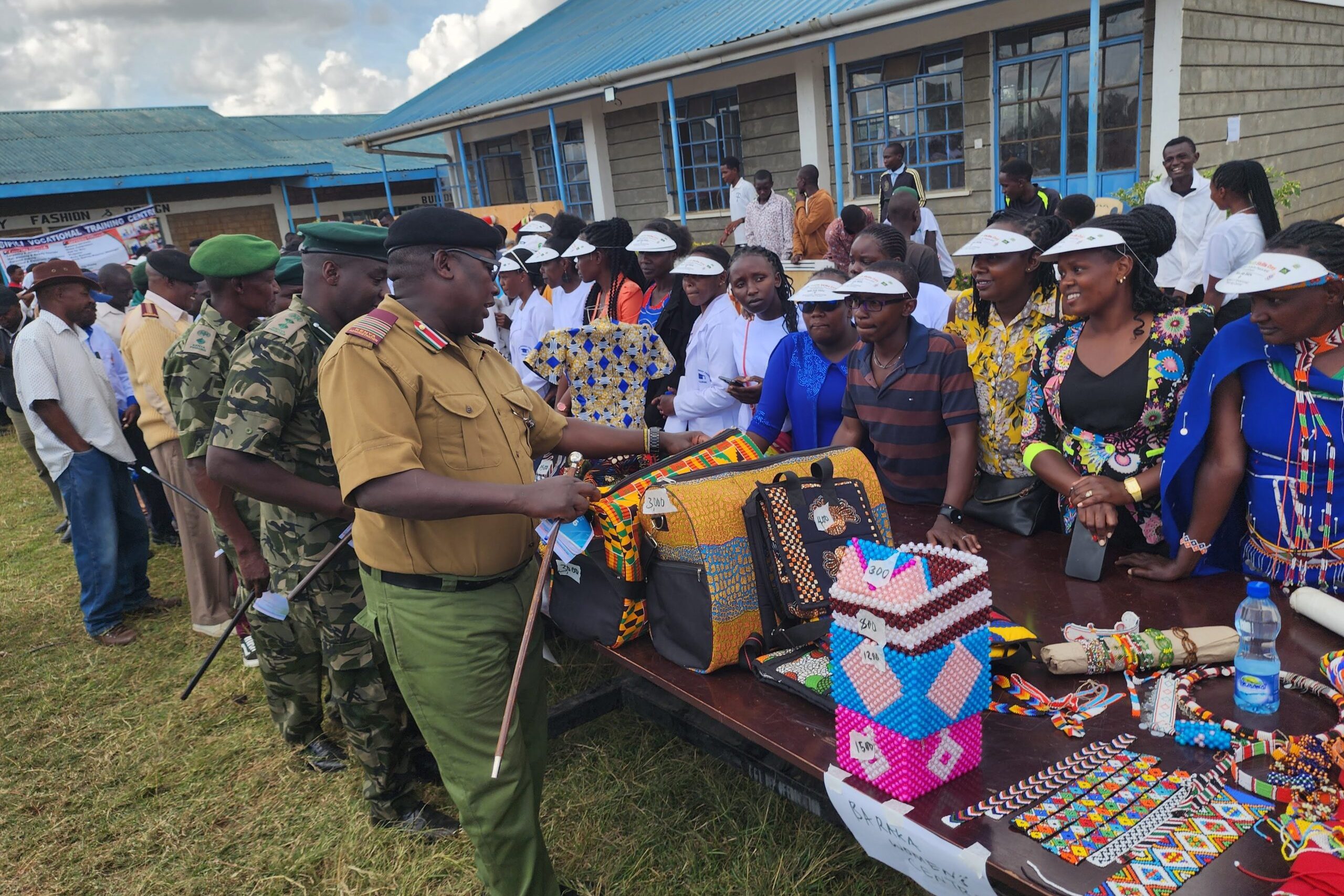 Laikipia county Assistant county commissioner admires some exhibitions by students from Baraka college during Rumuruti world youth skills day